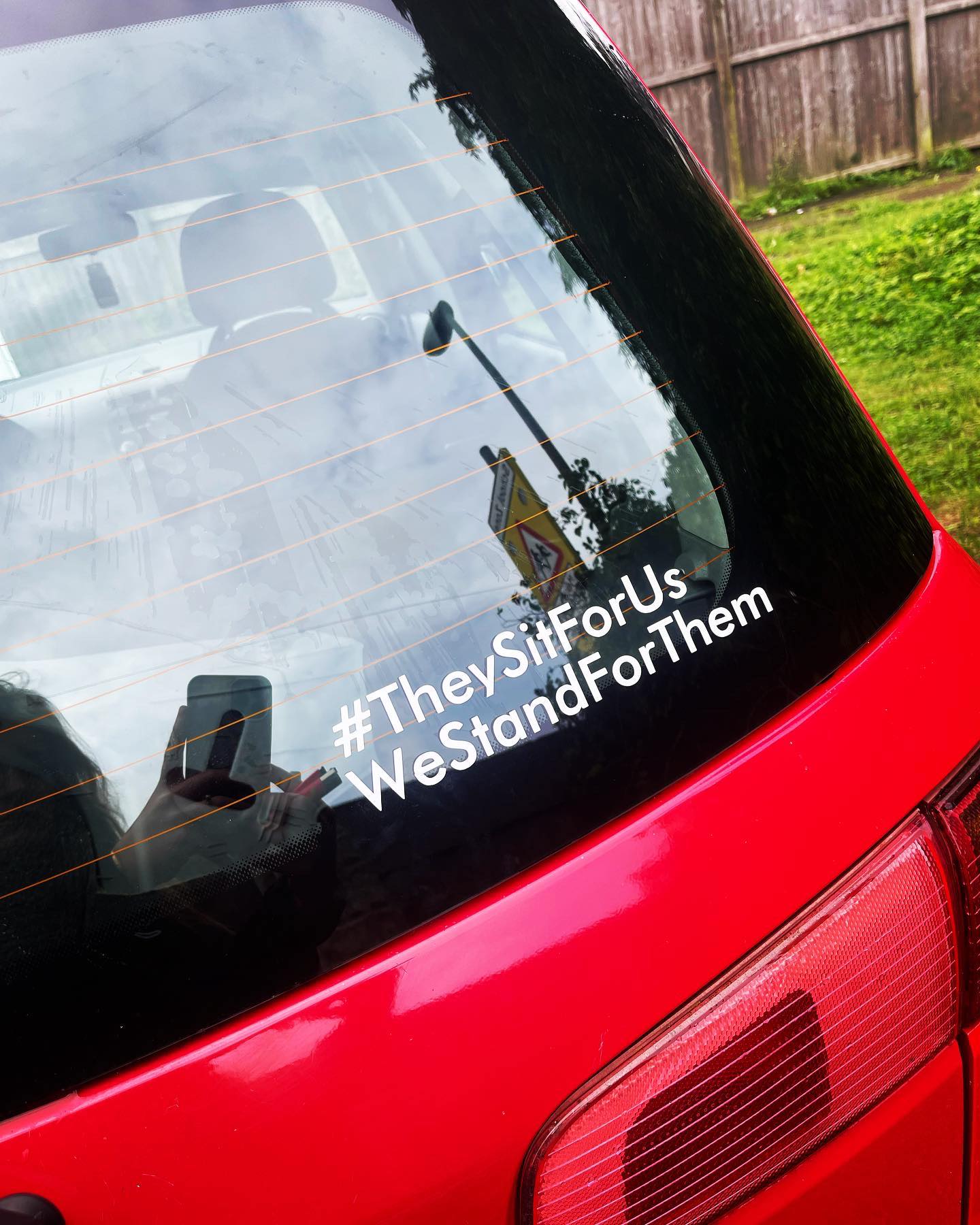 #They Sit For Us We Stand For Them Sticker