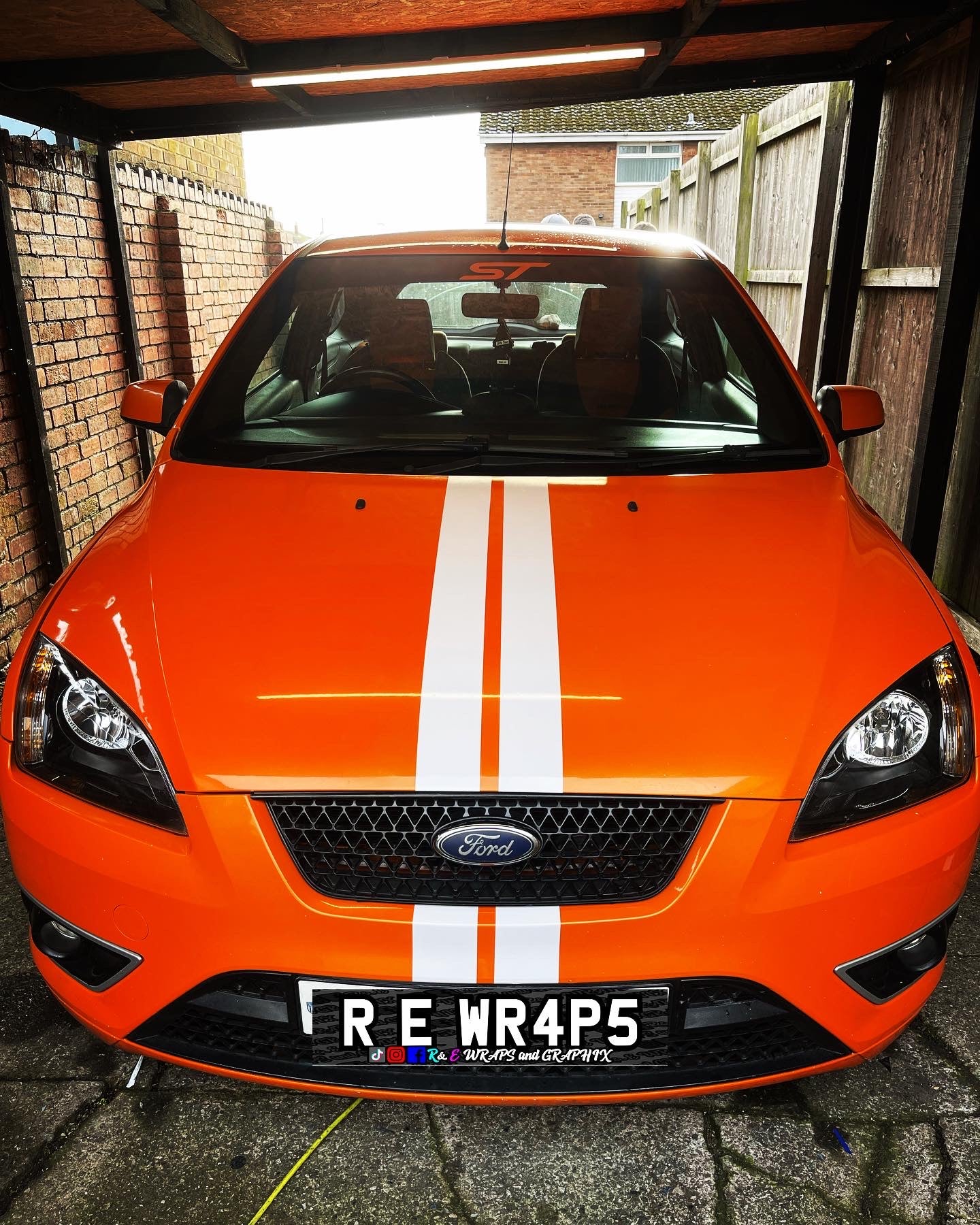 image_1c1a8ff6-99f8-445e-b155-ca00d80b094d - R&E Wraps and Graphics LTD - Ford Focus ST Racing Stripes - ford, ford focus racing stripe, racing stripes, st racing stripe