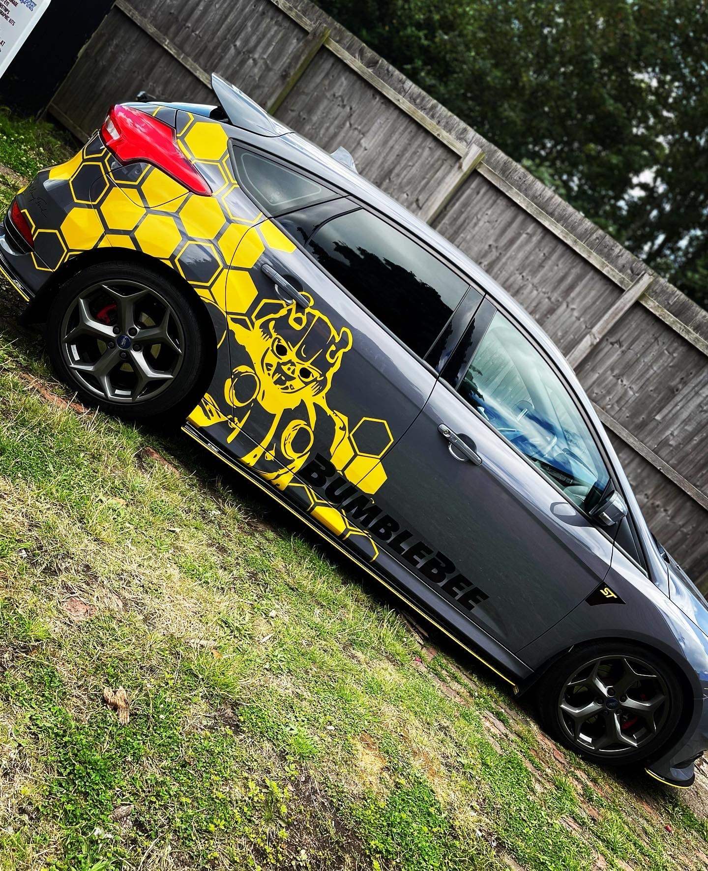 image_a7737779-0119-4bc3-bb06-9f0bba61bdc5 - R&E Wraps and Graphics LTD - Honey Comb Bumble Bee Graphic Kit Ford Focus MK3 - bumble bee, Bumble bee graphic kit, ford, Ford Graphic Kits, graphic kits, hexagon, hexagon graphic kit, Hexagon graphic kits, hexegons, honey comb, Honey Comb Bumble Bee Graphic Kit Ford Focus MK3, Honey comb graphic kits, transformer