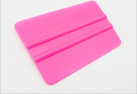 1x Neon pink plastic squeegee. 101 x 75mm