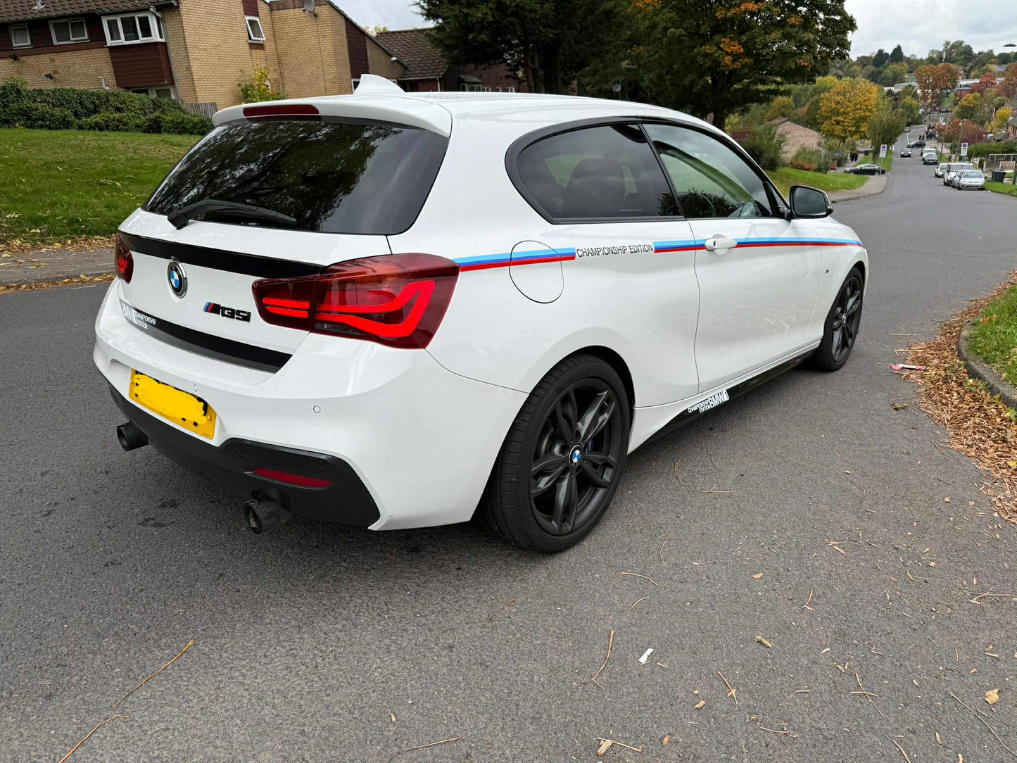 White BMW car with M Performance decals championship edition